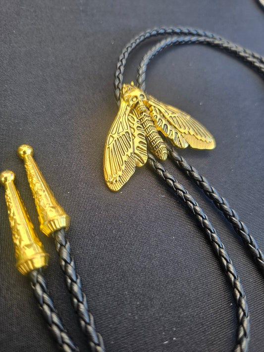 Golden moth bolo tie